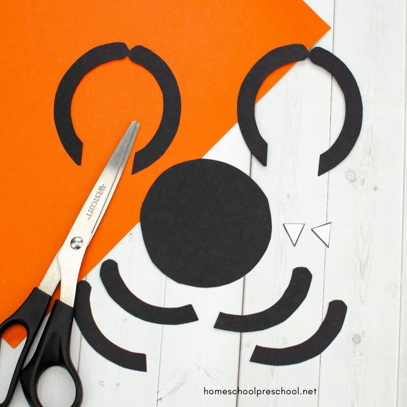 This preschool spider craft is perfect for October! As you head into Halloween, kids will love making this fun spider door hanger. The free template makes it a breeze!