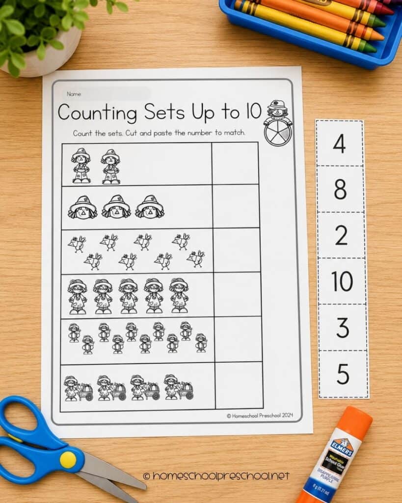 Scarecrow counting worksheet for preschoolers featuring cut-and-paste number matching activities that help children count sets of objects up to 10.