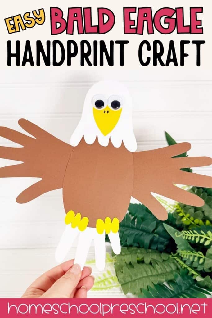 **Alt text:**

`Finished handprint bald eagle craft made from brown, white, and golden yellow cardstock with wiggle eyes, held up against a green fern background.`