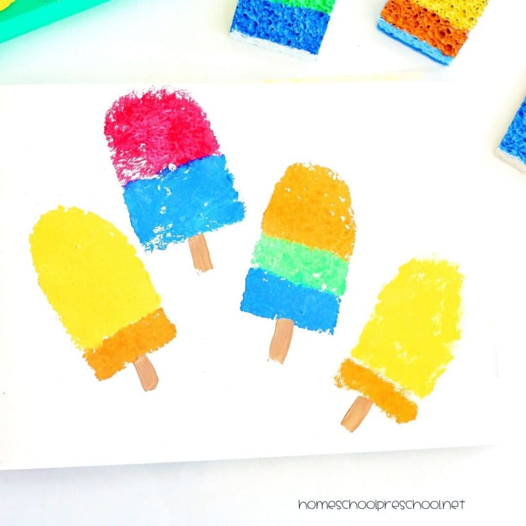 Colorful sponge-painted popsicle craft for preschoolers showing bright popsicle prints made with painted sponge stamps.