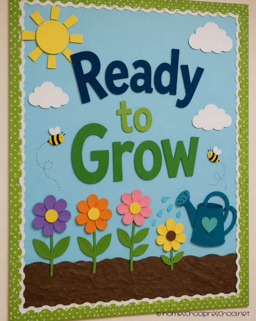 Ready to Grow preschool bulletin board with colorful paper flowers, bees, a watering can, sunshine, and the words "Ready to Grow."
