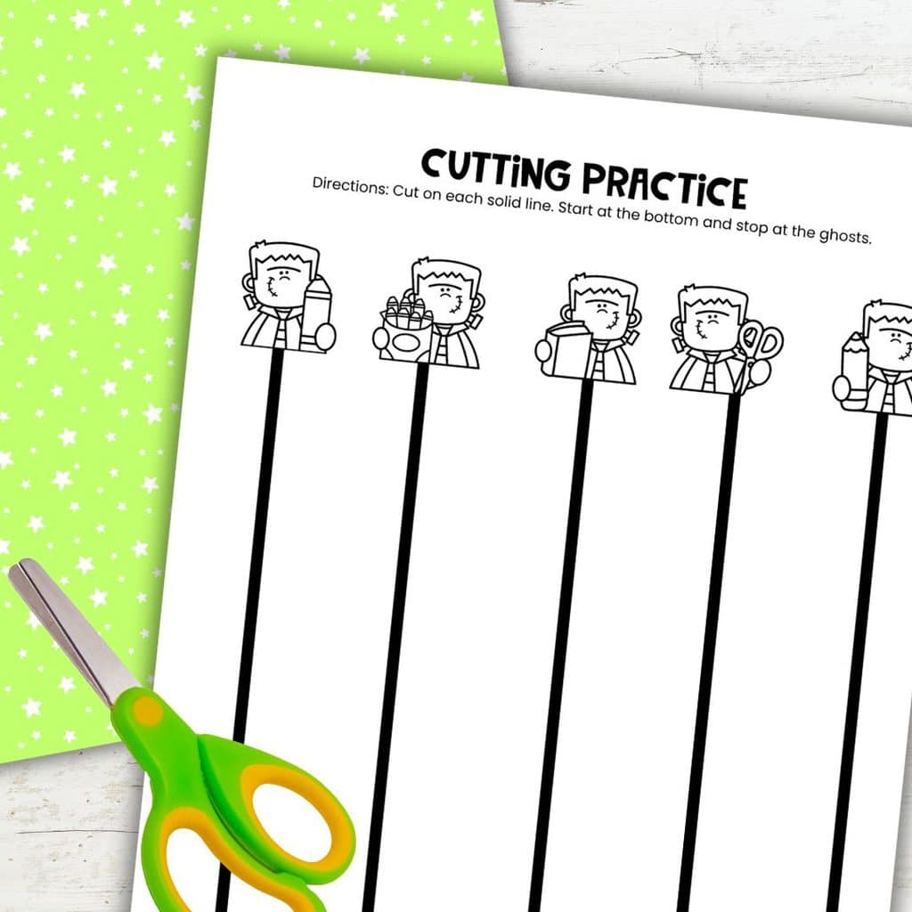 Frankenstein cutting practice page with vertical straight lines for preschoolers to cut from bottom to top.